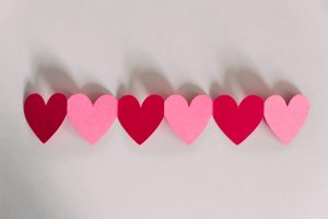 A garland of paper hearts made to encourage love. how to transform your brand to be loved instead of liked. future access shares tips on how you can improve your business. st catharines.